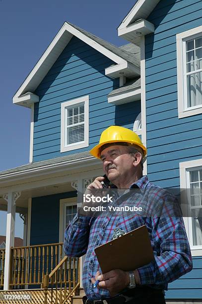 Construction Foreman Over The Phone Stock Photo - Download Image Now - Adult, Adults Only, Blue