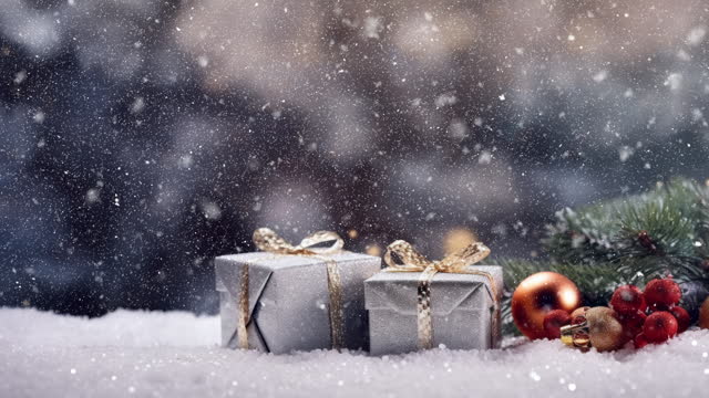 Amidst the snowy landscape, a collection of beautifully wrapped Christmas presents is artfully arranged, each package placed with care upon the glistening snow.