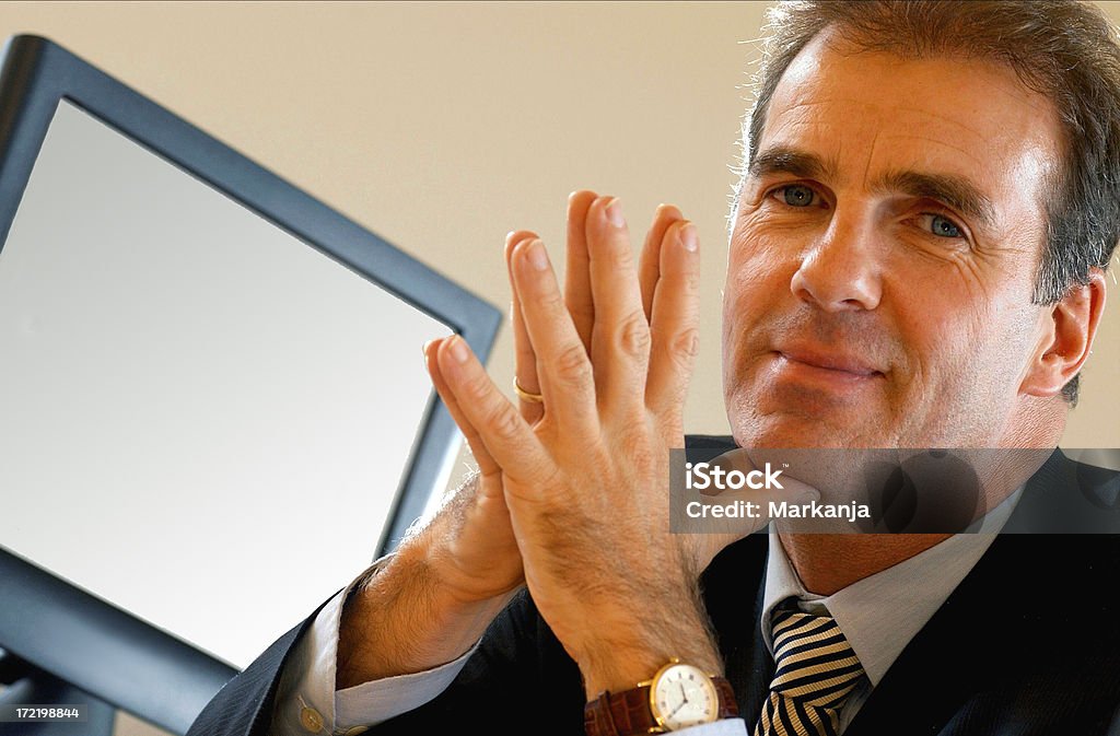 Man and his screen Close up of a business man sitting in front of a computer screen. The screen can easily be used for filling in designers own messages. Room for copy space too. Adult Stock Photo