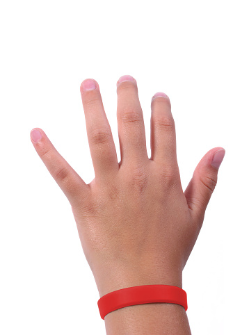 Hand with red Wristband on a white background. The red color is a symbol of AIDS also of DARE, Red Ribbon Week, Drug Abuse Resistance, Education, DUI Awareness, Epidermolysis Bullosa, Heart Disease, Heart Disease (Congenital), HIV, Lymphoma, Mothers Against, Drunk Driving (MADD), Substance Abuse, Supraventricular, Tachycardia, Wolf-Parkinson-White...