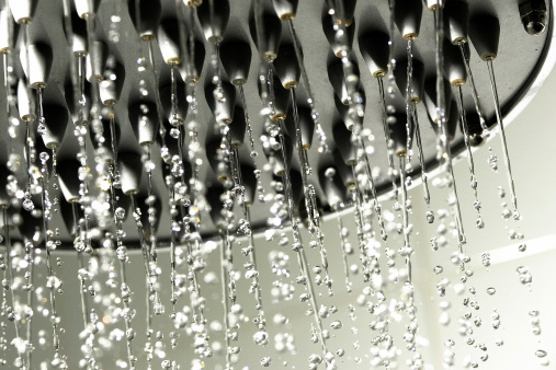 large showerhead with frozen water droplets.