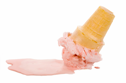 Isolated melting ice cream cone.