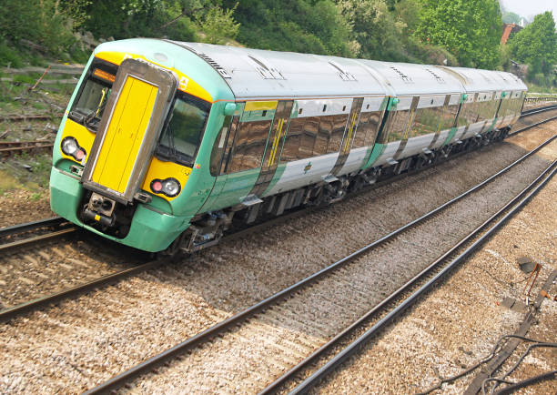 istock Green and yellow subway train traveling on the tracks  172199961