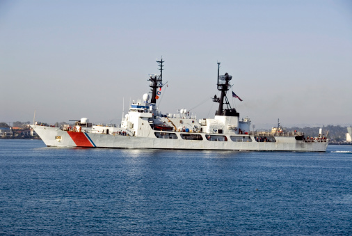 US Coast Guard Ship Entering San Diego Harbor. Crew seen on deck.