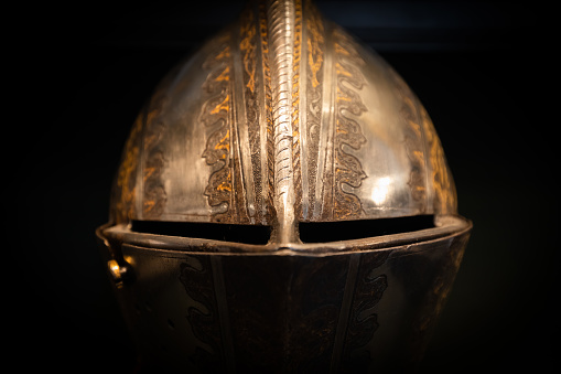 Antique armour on black background. Concept for security, safety and fantasy