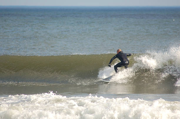 Surfer in Winter at the Jersey Shore stock photo