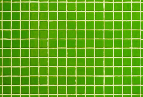 A section of a wall with small square green ceramic tiles. May be useful as a background.New to iStockphoto Click the badge below to sign up now: