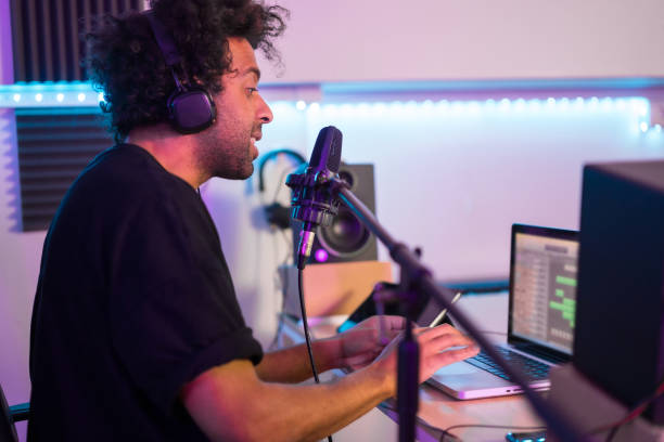 istock Musician recording a podcast using microphone and laptop 1722012074