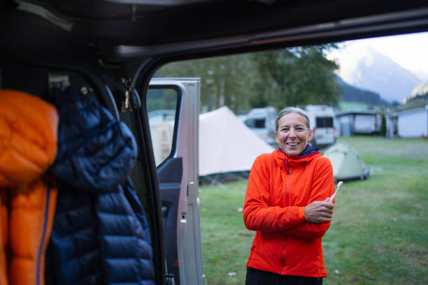 istock smiling shivering woman on campground 1722015332