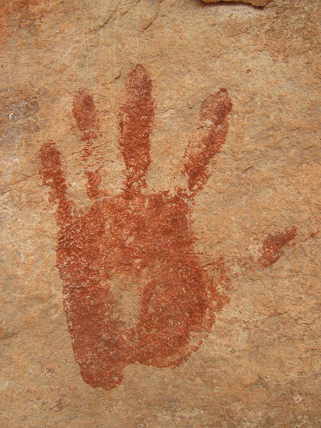 Ancient print of a left hand on a rocky wall Hand pictogram from Peublo ruin in Southern Utah cave painting photos stock pictures, royalty-free photos & images
