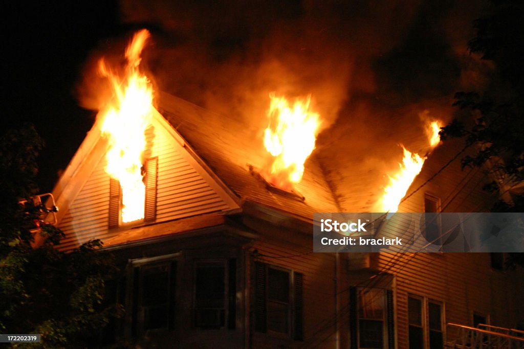 Night Fire "5:27am, 2-1/2 story wood frame with heavy fire showing on floor number 3. Beverly, Massachusetts, USA." Fire - Natural Phenomenon Stock Photo