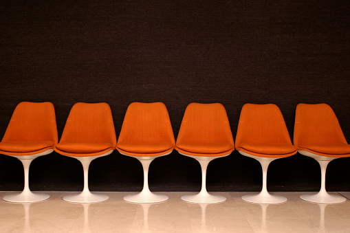 A group of chairs in a conference room