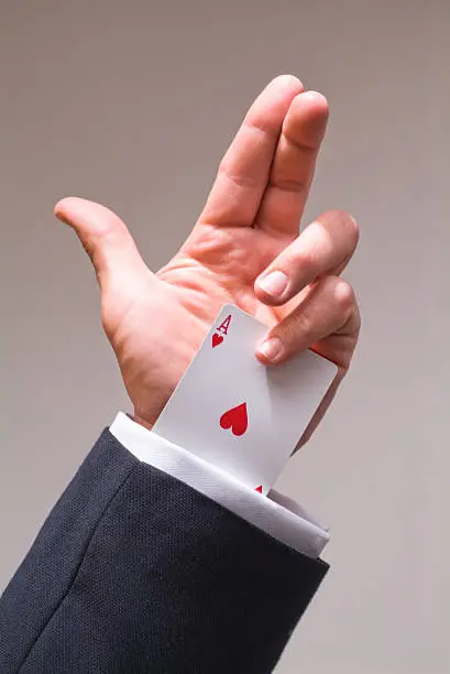 Conceptual Image of an Ace up a Businessman's Sleeve