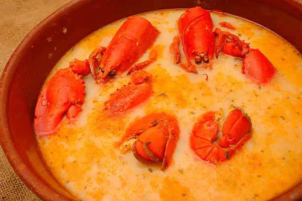 "This is the most famous dish of Mallorca and Menorca, a kind of lobster casserole, made with lobster, onions, tomato, garlic  herb-flavored liqueur, seafood broth and bread. Really tasty.Spanish food and drink lightbox:"
