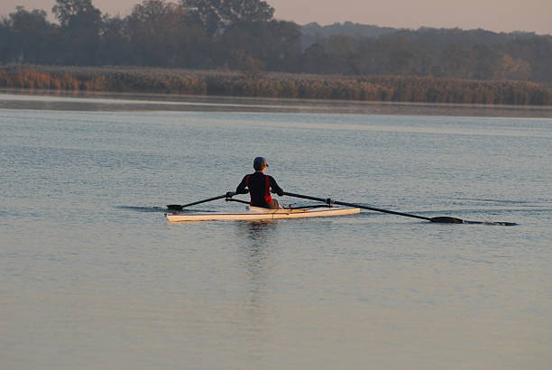 Sunrise rower "A rower at sunrise on a cool autumn day.  Chestertown, MD." chestertown stock pictures, royalty-free photos & images