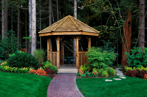 cedar gazebo in backyard garden