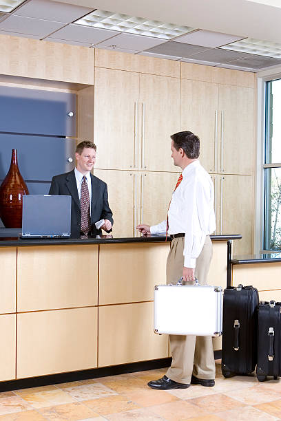 istock Businessman Checking in at the Reception Desk 172204848