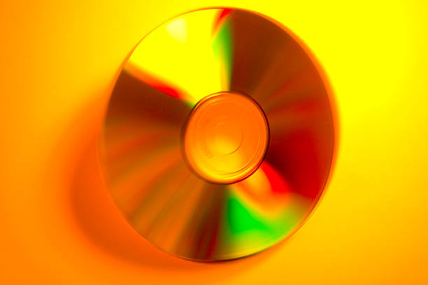 Abstract CD Spinning in Yellow stock photo