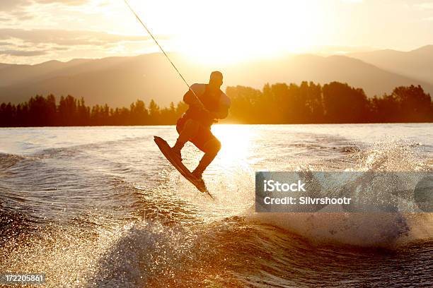 Wakeboarder At Sunrise Stock Photo - Download Image Now - Wakeboarding, Lake, Punting