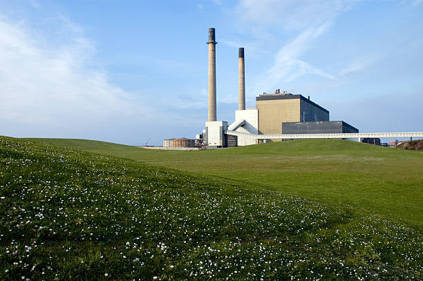 Big lawn with power station at the background stock photo