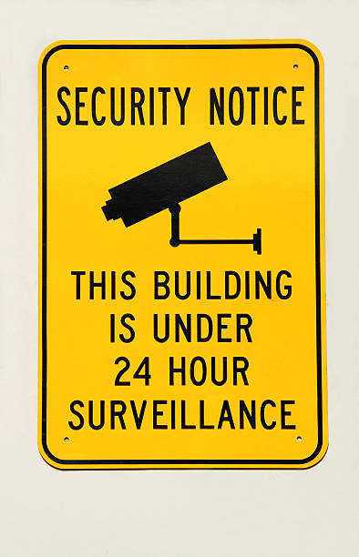 Security Sign Security sign indicating that building is under surveillance.See similar: surveillance camera sign stock pictures, royalty-free photos & images