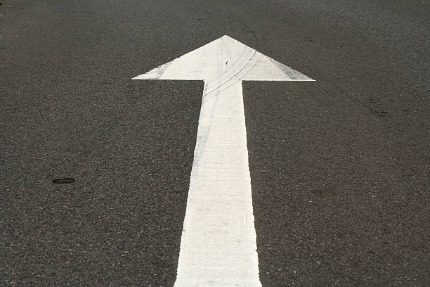 istock White traffic arrow on the road 172206902