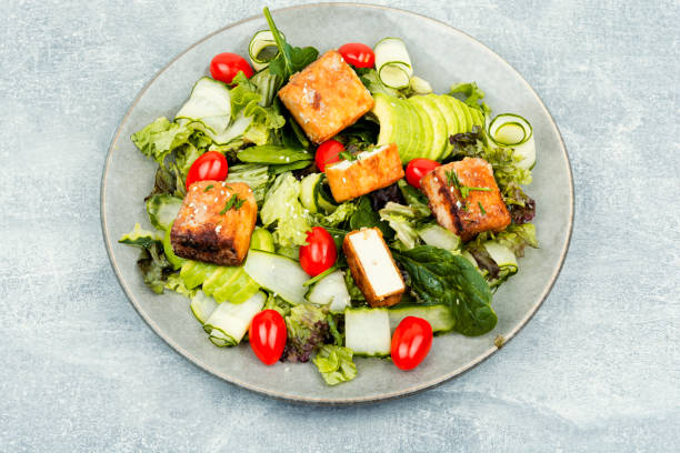istock Salad with fresh vegetables and tofu. 1722071699