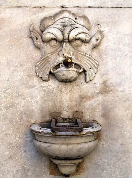 pittoresque waterfountain in small italian village.See other drinking fountains;