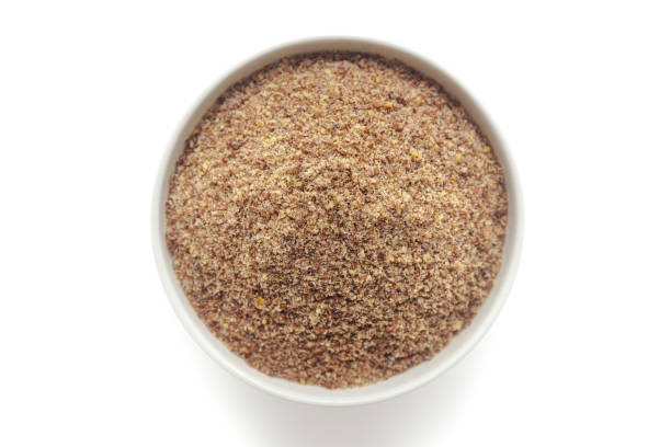 istock Organic Flaxseed Flour (Linum usitatissimum) in a white ceramic bowl. 1722073391