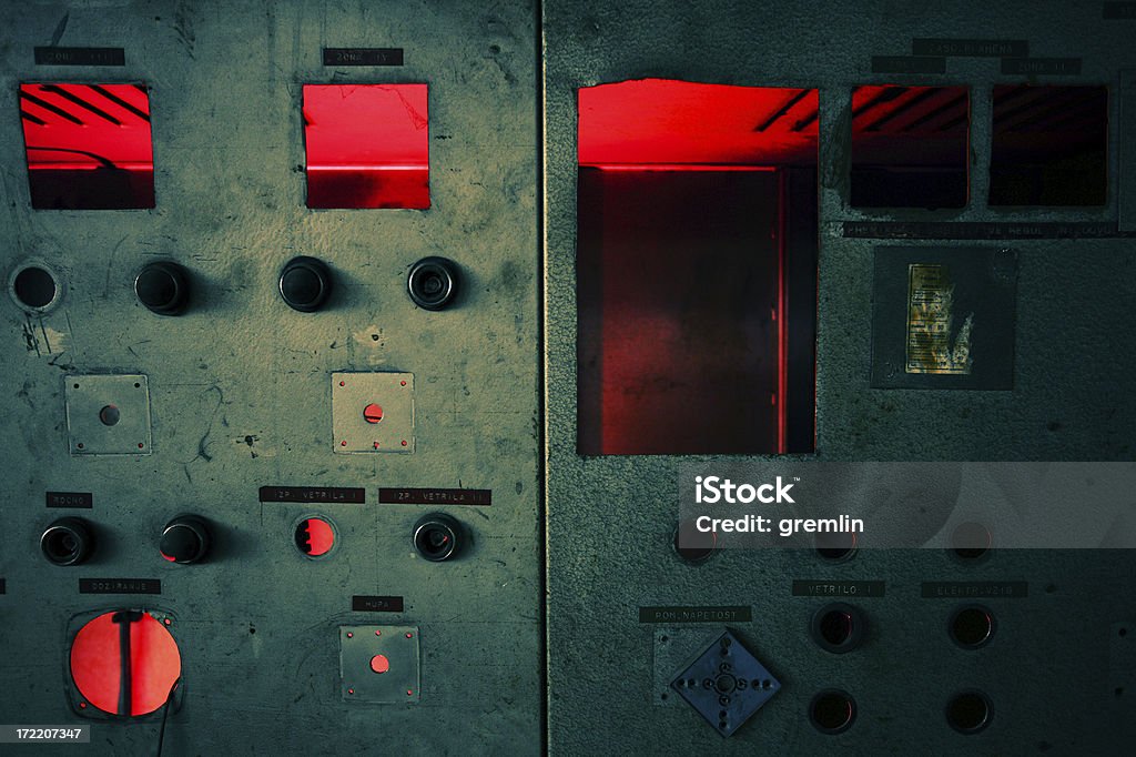 Derelict Derelic control panel in old, long forgotten industrial plant. Lit from the inside for that special retro spooky feeling.) Abandoned Stock Photo