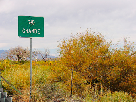 A Rio Grande sign full of bullet holes.