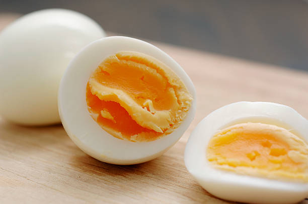 sliced boiled and peeled hens egg stock photo