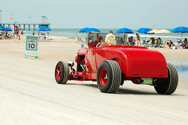 Cruisin' The Beach "A souped up hot rod cruises Daytona Beach, FL." daytona beach stock pictures, royalty-free photos & images