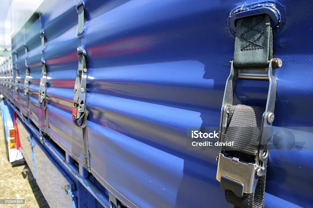 Load Strap 2 Detail of a load strap on a tautliner truck curtain wall looking along the truck towards the cabin Truck Stock Photo