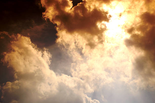 Cloudscape A dramatic picture of the heavens with the sun burning through a cloud formation.  Taken with a sunset filter. storm cloud sky dramatic sky cloud stock pictures, royalty-free photos & images