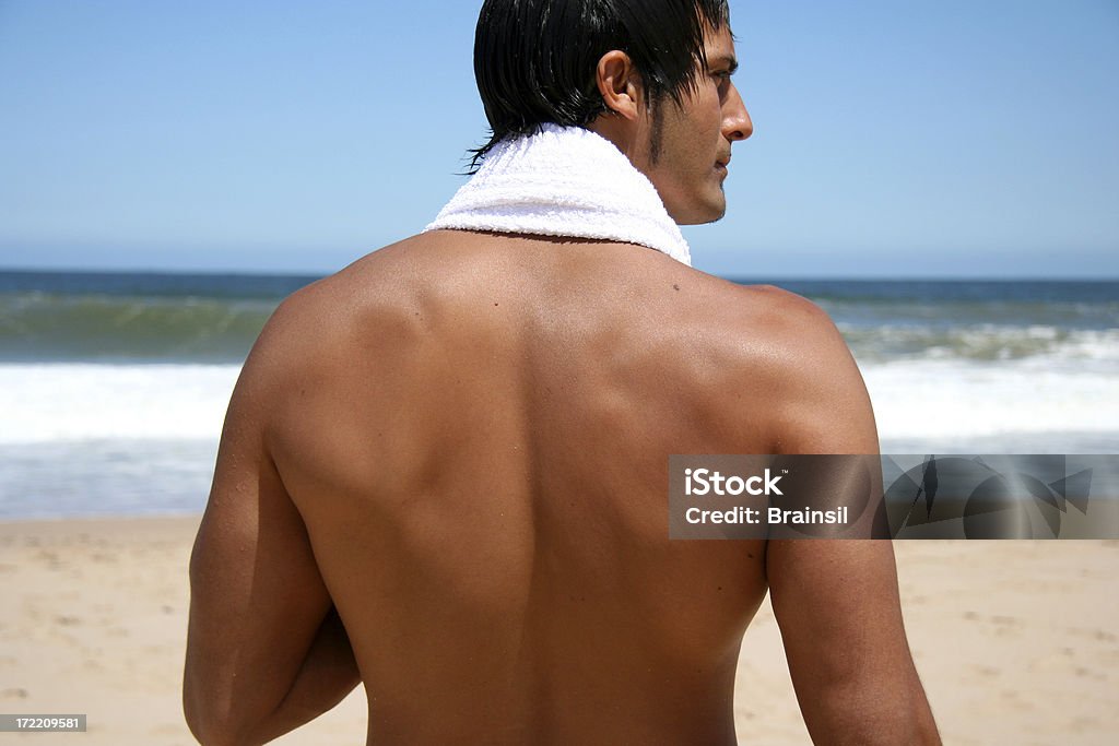 Człowiek na plaży - Zbiór zdjęć royalty-free (Mężczyźni)