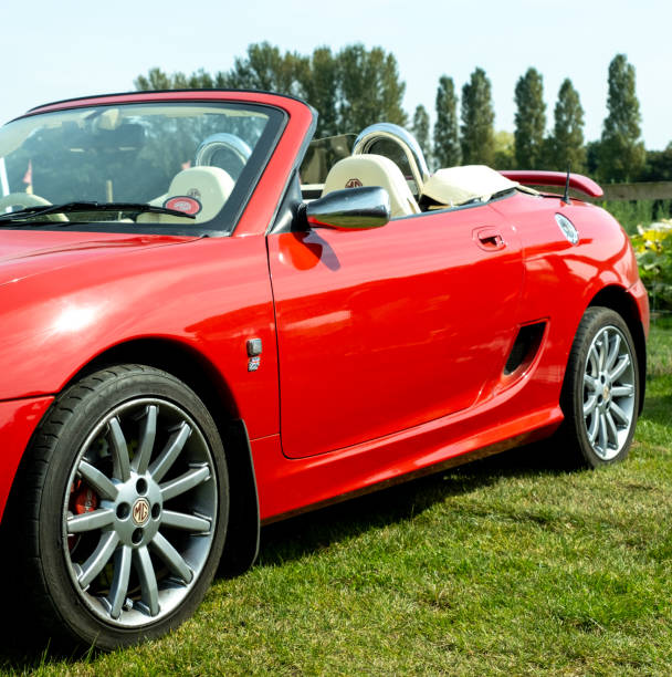 Wroxham, Norfolk, UK  September 10 2023. Side on view of a classic MG TF sports car in brilliant red