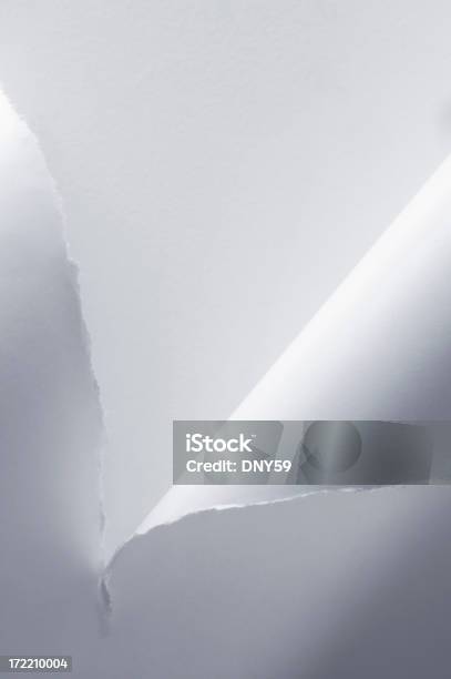 Foto de Pedaço De Papel Rasgado Em Meio A e mais fotos de stock de Branco - Branco, Conceito, Corte Transversal