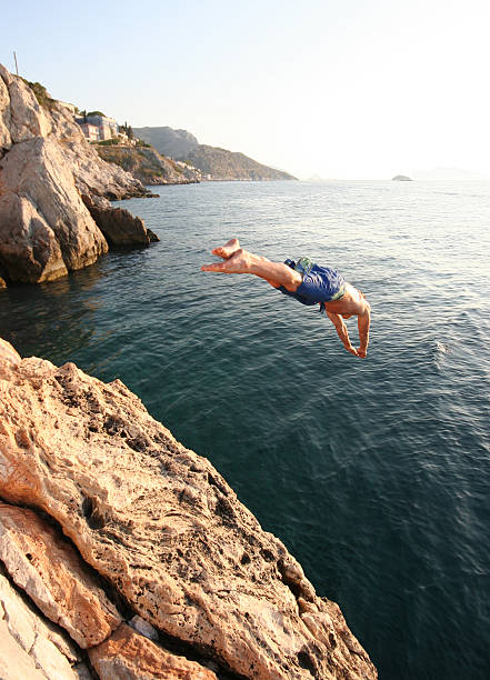 Cliff diver 2 Cliff diver in Greece.Please see some similar pictures from my portfolio: cliff jumping stock pictures, royalty-free photos & images