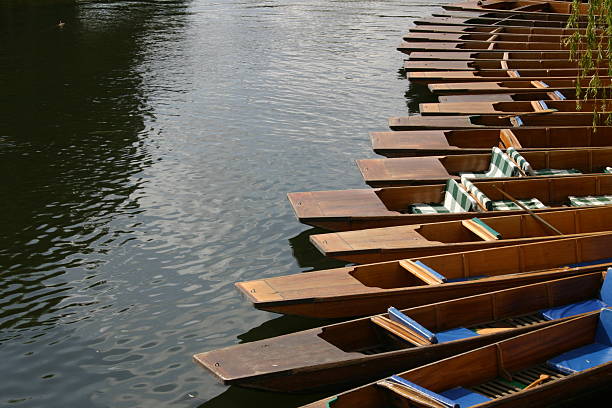 Punts on the river Cam, Cambridge, England. "Punts on the river Cam, Cambridge, England." punting stock pictures, royalty-free photos & images