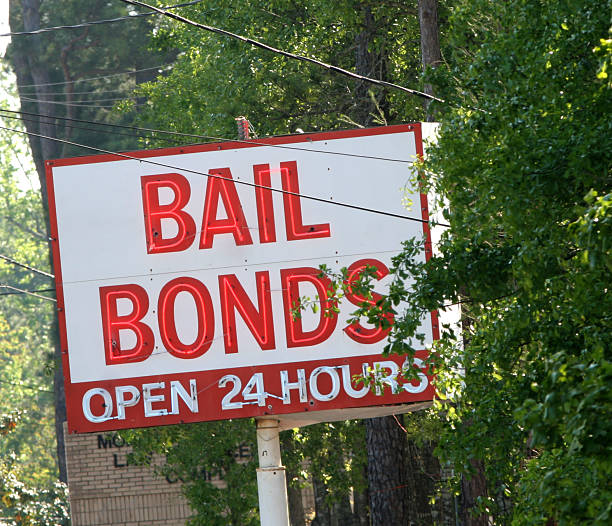 Bail Bonds a red and white neon sign showing a Bail Bonds office that is open 24 hours a dayPlease see my similar photos: bail stock pictures, royalty-free photos & images