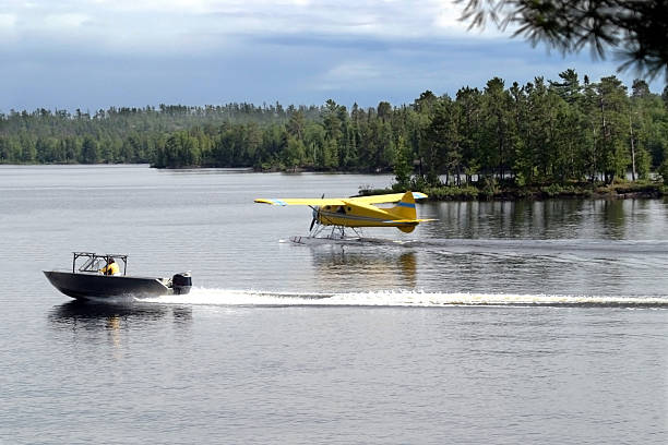 Float plane and motor boat at busy wilderness outfitter