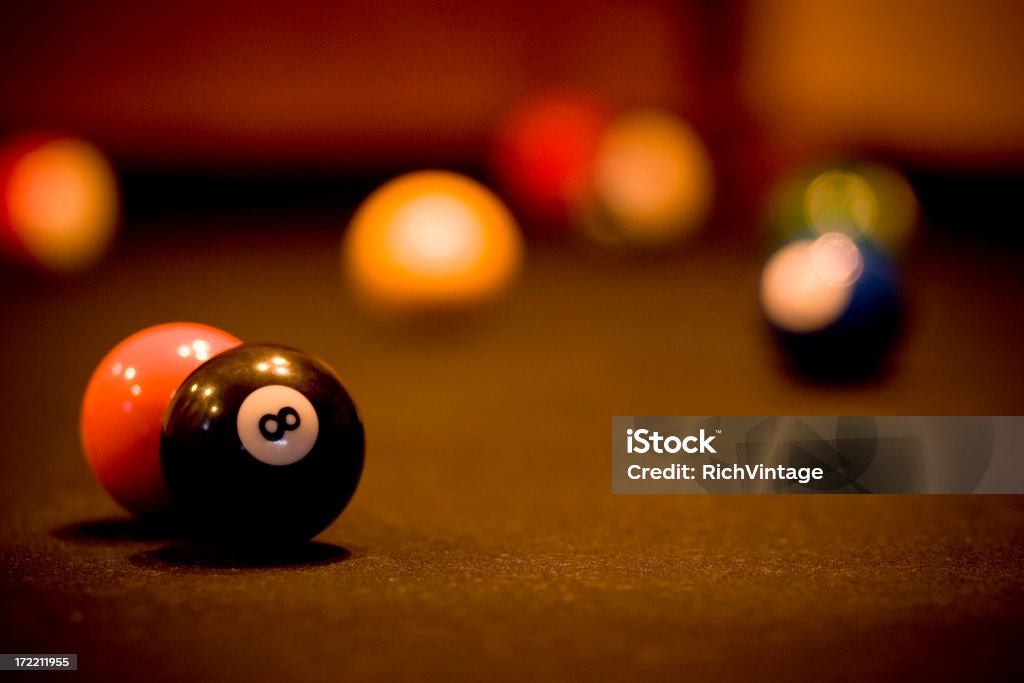 Billiard Balls Several billiard balls rest on a pool table. Selective focus with plenty of room for type. Pool - Cue Sport Stock Photo