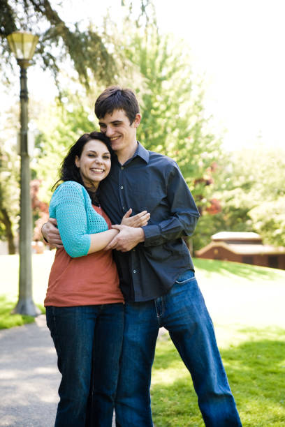 istock cute young urban couple in park 172212271