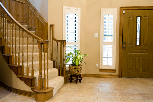 Entry hall with stairway and front door.  MORE LIKE THIS... in lightboxes below.  