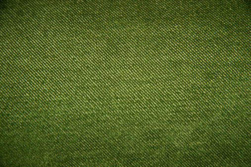 This is a close up picture of green fabric showing a lot of detail. The visual effect created by the weave of the fabric creates a pattern of green and whitish green lines going from top left to bottom right.  http://static1.squarespace.com/static/54e1023fe4b0d9caed7c9181/t/55982562e4b0d2540b6b68f2/1436034403385/backgrounds