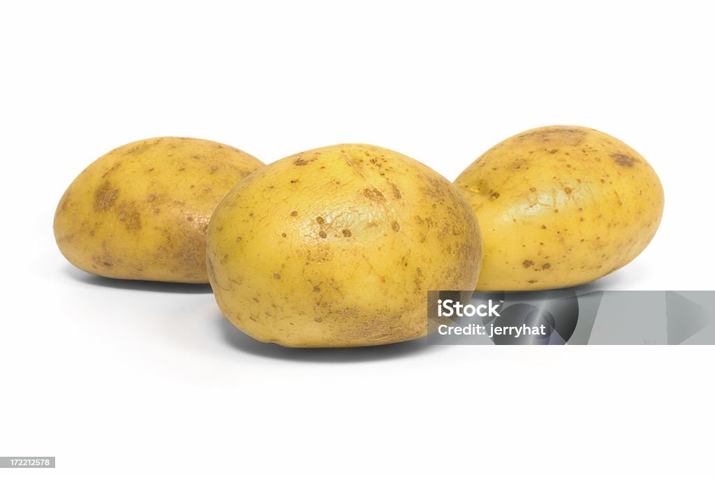 Baking Potatoes Three baking potatoes shot from a low angle. Baked Potato Stock Photo