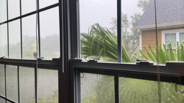 Rainy day view through house interior window