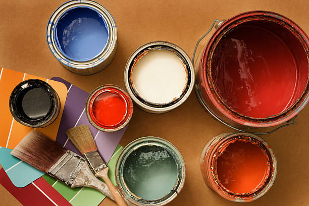 Paint Cans for Home Decorating and Improvement, Brushes, Color Swatches Open cans of paint, paint brushes and color swatches for home decorating or home improvement projects. latex stock pictures, royalty-free photos & images