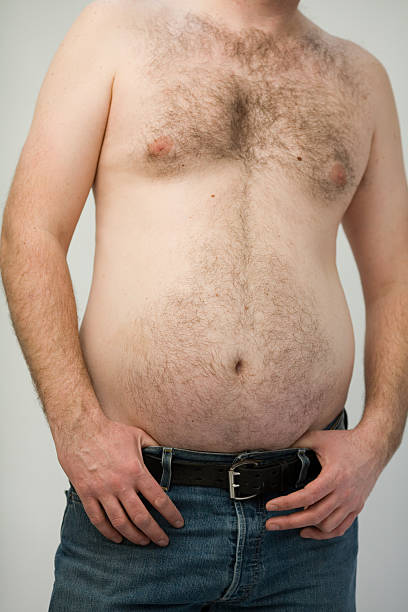 Beer Belly A shirtless man with a big hairy gut.Others from this series: hairy fat man pictures stock pictures, royalty-free photos & images
